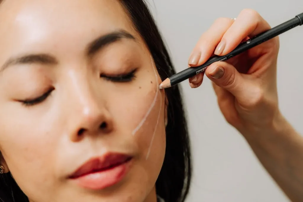 woman getting marked for a PDO thread lift at Curated Medical in Scottsdale