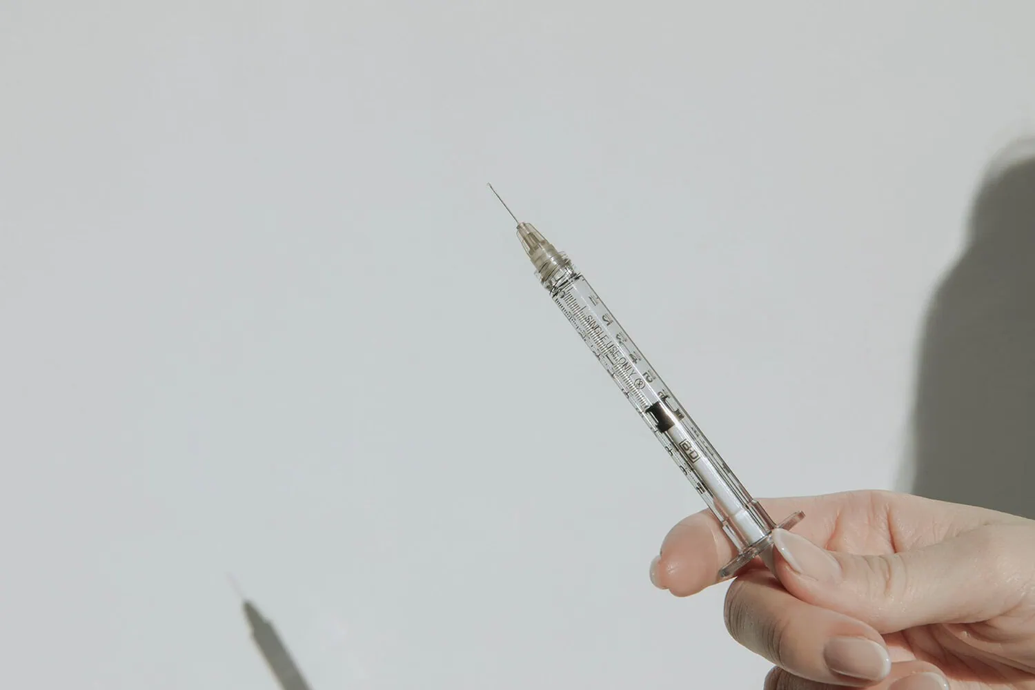 can botox stop working? syringe with botox against a white wall