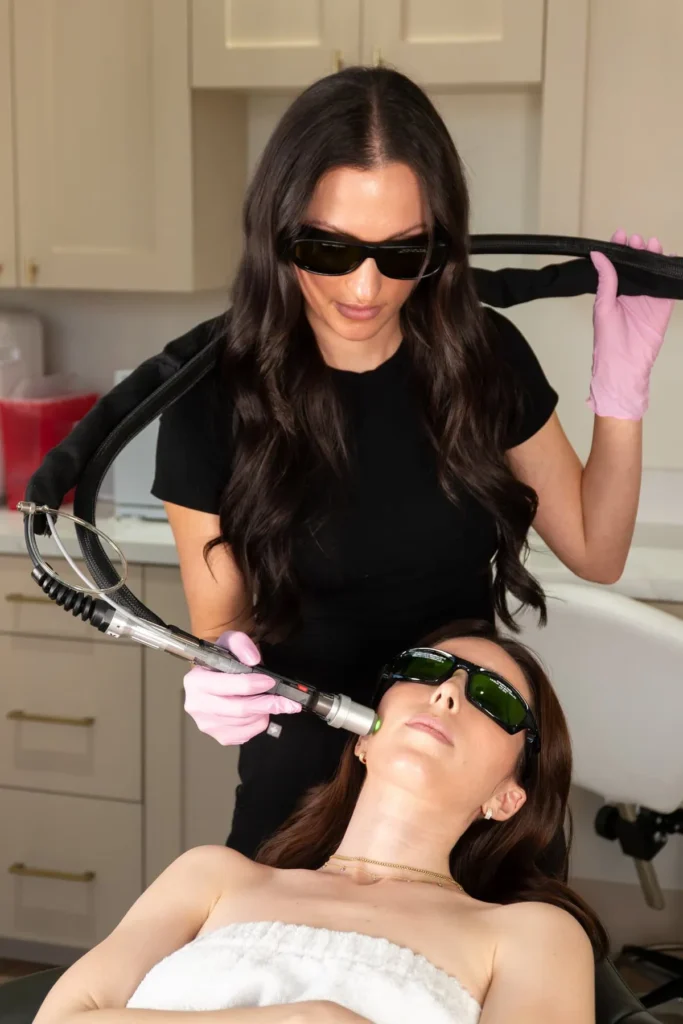 client receiving laser treatment against dark skin spots