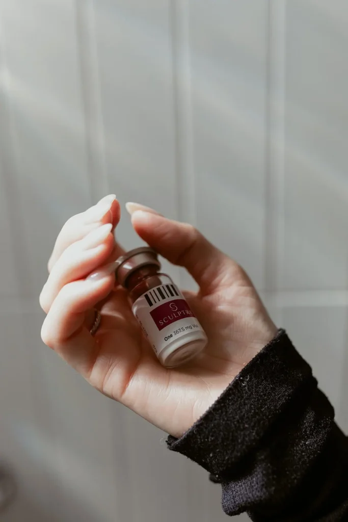 hand holding a Sculptra bottle