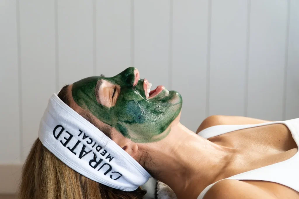 woman laughing with green sea peel